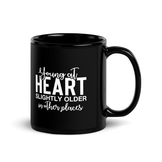 Young at Heart Slightly Older in Other Places Black Glossy Mug